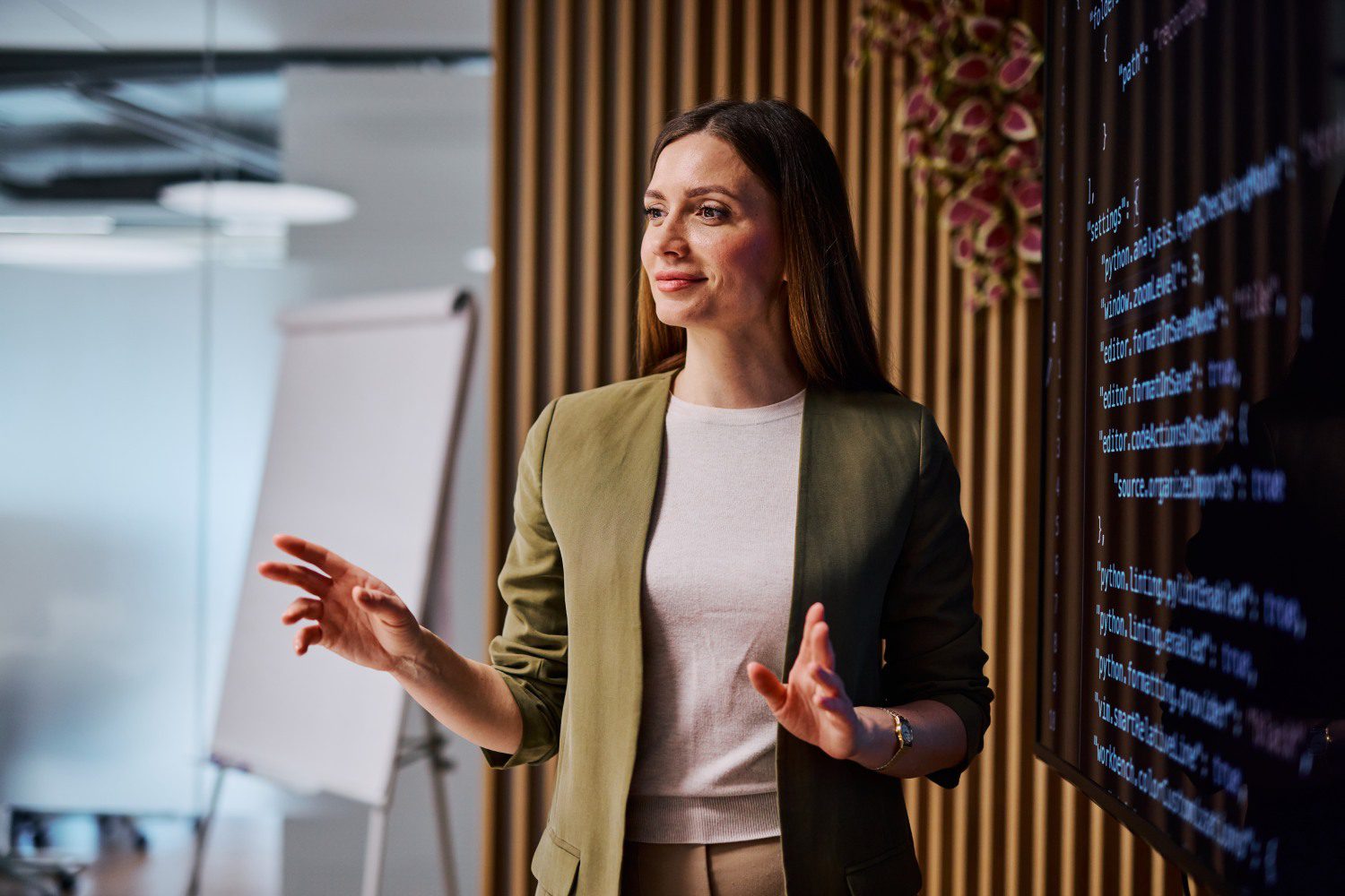 Woman giving a presentation in office.